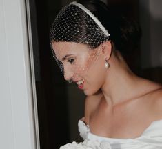 a woman with a veil on her head