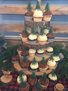 cupcakes are arranged in the shape of a tree