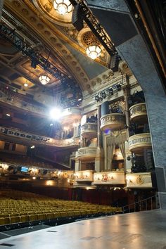 the interior of an auditorium with lights on