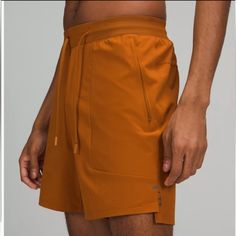 Men’s License To Train Shorts Length 7” Sweat Wick For More Comfort Waistband Drawcord Secure Zip Pockets Classic Tapered Fit Orange Athleisure Activewear With Built-in Shorts, Orange Workout Shorts With Pockets, Orange Activewear With Built-in Shorts For Training, Moisture-wicking Orange Shorts For Gym, Moisture-wicking Orange Gym Shorts, Orange Activewear With Built-in Shorts For Gym, Orange Sports Shorts With Pockets, Orange Moisture-wicking Gym Shorts, Orange Athletic Shorts With Elastic Waistband For Sports