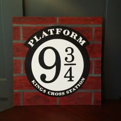 a sign that says platform 9 3 / 4 king's cross station on it