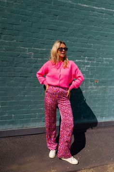 Pink geometric patterned flowy, straight cut pants-trousers with two pockets on the sides and have a button on the front. These pants are the 'main character' and are the perfect statement piece to add to your wardrobe! Sizing runs true to size Our model wears the Pink Fanie Cardigan Button on the front Two pockets on the sides Straight cut Sizes: S / M / L S: Length 42.52 in - Width 13.39 in M: Length 42.91 in - Width 14.17 in L: Length 43.31 in - Width 14.96 in Contexture: 100% polyester Washi Casual Pants With Geometric Pattern For Spring, Chic Summer Bottoms With Geometric Pattern, Bold Straight Pants, Wide Leg Bottoms With Geometric Pattern For Spring, Wide Leg Patterned Pants For Loungewear, Patterned Wide Leg Loungewear Pants, Patterned Wide Leg Pants For Loungewear, Bold Straight Pants For Spring, Pink Pants For Fall Day Out