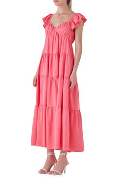 Stroll confidently through your day in this ruffled sundress in a flowy maxi silhouette with a bow in the back and a tiered skirt complete with pockets. Sweetheart neck Cap sleeves Side-seam pockets Lined 100% polyester Hand wash, dry flat Imported Flowy Tiered Maxi Dress For Summer, Pink Summer Maxi Dress With Ruffled Straps, Pink Maxi Dress With Ruffled Straps For Vacation, Pink Tiered Maxi Dress With Smocked Back, Pink Tiered Maxi Dress For Summer, Pink Tiered Skirt Maxi Dress For Summer, Tiered Maxi Dress With Smocked Back And Flowy Skirt, Pink Tiered Dress With Smocked Back For Summer, Tiered Maxi Dress With Tie Back For Brunch