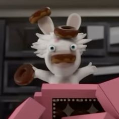 an animated rabbit with donuts on its head