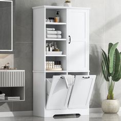 a bathroom with a white cabinet and sink