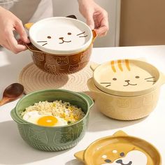 Add a touch of whimsy and charm to your dining experience with these Cartoon Ceramic Cat Dog Noodle Bowls With Lids. Crafted from high-quality ceramic material, these bowls are not only adorable but also durable for everyday use. Perfect for serving soups, salads, fruits, or noodles, these bowls feature a cute animal design that will bring a smile to your face every time you use them. Each bowl is hand-painted with a solid pattern, making them unique and one-of-a-kind. With a capacity of less than 1 liter, these bowls are perfect for individual servings. The Axya Ceramic Cat Dog Noodle Bowls are CE/EU, CIQ, EEC, LFGB, and SGS certified, ensuring that they meet the highest standards of quality and safety. Whether you're enjoying a cozy night in or hosting a dinner party, these bowls will ma Led Logo, Salad Fruit, Cat Food Bowl, Tanah Liat, Keramik Design, Ceramic Cat, Ramen Bowl, Cute Kitchen, Noodle Bowls