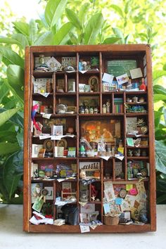 a wooden shelf filled with lots of different items