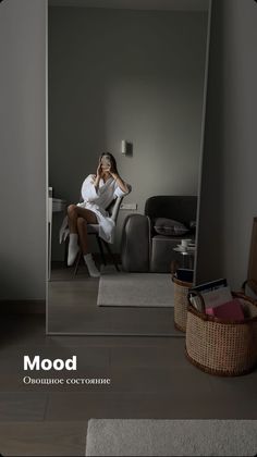 a woman sitting on a chair in front of a mirror with the caption mood