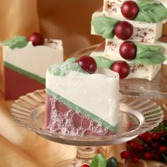 a piece of cake sitting on top of a glass plate next to other desserts