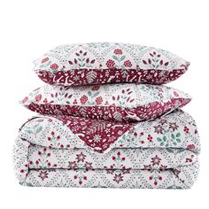 three pillows stacked on top of each other with red and white floral designs in them