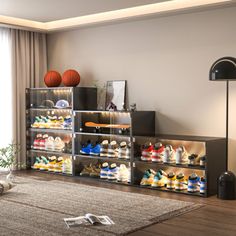 a living room filled with furniture and lots of shoes on top of the shelves in front of a large window