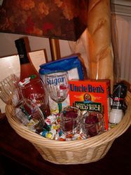 a basket filled with lots of food and condiments on top of a table