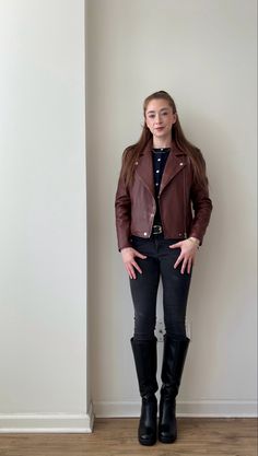 Styling red and navy blue together! I’m wearing tall black boots, gray skinny jeans, a navy blue cardigan, burgundy leather jacket, black belt, and gold jewelry. Casual, neutral outfit for fall/winter.