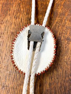 Soft leather, bead and agate bolo tie with stamped silver end tips. Artisan made with extraordinary detailed bead work. Hang length 18" Bolo 2"(w) x 2 3/8"(h) Tassels 2” long Condition: Very good. One tassel is slightly bent. Adjustable Oval Artisan Jewelry, Artisan Adjustable Bolo Ties For Gifts, Artisan Lariat Jewelry For Rodeo, Artisan Lariat Bolo Tie With Adjustable Length, Western Style Adjustable Beaded Jewelry, Handmade Lariat Bolo Tie For Rodeo, Artisan Bolo Ties With Adjustable Length As Gift, Artisan Bolo Ties With Adjustable Length, Handmade Bohemian Bolo Tie