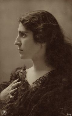 an old black and white photo of a woman