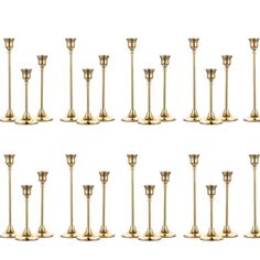 a set of twelve brass candlesticks with different sizes and shapes, all lined up in rows