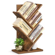 a wooden book stand with books on it and a potted plant next to it