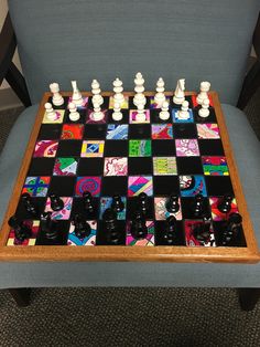 a chess board sitting on top of a blue chair