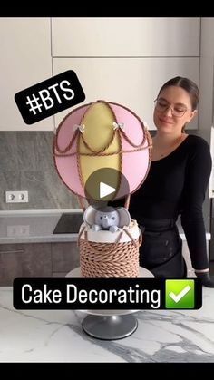 a woman holding a cake decorated with teddy bears