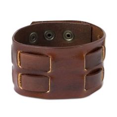 This attractive but rugged bracelet for men is crafted by hand in Thailand. The brown bracelet is designed by artisan Chaloemphon who specializes in creating stylish leather jewelry for men and women. Brass snaps secure the bracelet at one of two lengths for a comfortable fit. Adjustable Leather Bracelet With Strap, Adjustable Leather Wristband With Bracelet Strap, Adjustable Leather Bracelet With Wrist Strap, Adjustable Leather Strap Wristband, Adjustable Leather Wristband With Waxed Finish, Adjustable Brown Leather Bracelet With Wrist Strap, Adjustable Waxed Leather Bracelet, Leather Bracelets For Everyday Use, Adjustable Brown Wristband For Everyday Use