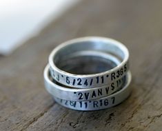 "Stamped stacking rings with custom words personalized with your child's name, birthdate, quote or anything else! Customize to your heart's desire.  Stack these sterling silver rings or wear them one at a time.   Please see our policies page for the turn around time on orders here... http://etsy.me/shoppolicies  This listing is for THREE rings. Each ring measures 3mm high. Stacked the rings measure 9mm high or just a wee bit past 3/8\" high.   The font shown in all uppercase is the only font ava Silver Stamped Stackable Promise Rings, Personalized Adjustable Stackable Rings For Birthday, Stackable Sterling Silver Rings For Personalized Gift, Personalized Silver Engraved Ring For Birthday, Personalized Silver Engraved Ring, Silver Hand Stamped Stackable Promise Rings, Customizable Silver Stackable Rings For Personalized Gifts, Silver Sterling Stackable Rings For Birthday, Silver Hand Stamped Rings For Personalized Gift