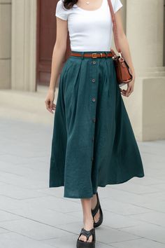 Showcase your style in a sophisticated mid-calf A-line skirt, beautifully tailored in a lush shade of green. The skirt features a distinctive button detail that adds a unique touch. Ideal for the blooming season of spring, this skirt is a perfect addition to any plus size wardrobe.  DETAIL * 100% Linen * Two side pockets * Back elastic waist * Button front skirt * Below Knee Length * Midi skirt  * A Line skirt * Perfect for Spring, Summer and Autumn * Wash by hand or machine with cold water * Mo Long Cotton Skirt With Buttons, Relaxed Cotton Maxi Skirt With Buttons, Casual Long Skirt With Buttons, Casual Full Skirt With Button Closure, Casual Full Skirt Bottoms With Button Closure, Cotton Full Skirt With Buttons, Relaxed Full Skirt With Buttons, Summer Wide Leg Maxi Skirt With Button Closure, Knee-length Cotton Skirt With Buttons