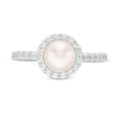 a white pearl and diamond ring