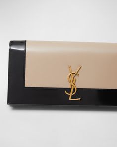 Saint Laurent "Kate" clutch bag in twotone napa leather    Features YSL logo lettering    Flap top with snap closure  Bronze hardware.   Interior, one card slot    Approx. 7.9"H x 11.4"W x 3"D   Made in Italy Luxury Tan Rectangular Clutch, Elegant Formal Wallets With Logo, Designer Evening Wallets With Logo Plaque, Tan Rectangular Clutch For Evening, Formal Rectangular Wallet With Logo, Designer Tan Wallet For Evening, Tan Leather Rectangular Clutch, Classic Tan Clutch For Formal Occasions, Formal Tan Leather Clutch