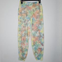 Add A Splash Of Color To Your Wardrobe With These Vibrant Tie-Dye Jogger Pants! Perfect For Lounging At Home Or Running Errands, These Pants Offer Both Comfort And Style. Key Features Include: - Soft, Breathable Fabric That Feels Great Against The Skin - Elastic Waistband For A Secure Fit - Stylish And Unique Tie-Dye Pattern In Pastel Colors - Ideal For Casual Outings Or Cozy Days In. Elevate Your Casual Wear With These Eye-Catching Joggers! Acid Wash Pants With Pockets For Spring, Acid Wash Pants With Elastic Waistband In Relaxed Fit, Acid Wash Pants With Elastic Waistband And Relaxed Fit, Acid Wash Relaxed Fit Pants With Elastic Waistband, Pink Joggers With Elastic Waistband For Spring, Casual Multicolor Joggers With Elastic Waistband, Pink Relaxed Fit Joggers For Spring, Summer Loungewear Joggers, Spring Pink Relaxed Fit Joggers