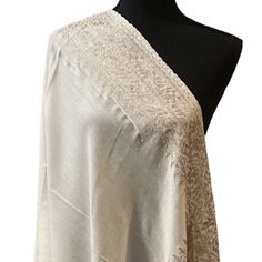 The Shawl Is Soft And Warm With Gold And Silver ( Two Toned ) Zari Border . Measurement Is 30 X 80 . Material: 100%Pashmina Feel: Lightweight Soft Touch Care And Instructions Dry Cleaning Is Recommended Hand Wash In In Luke Warm By Soaking Gently In Water And Then Air Dry It . Do Not Tumble Dry.Do Not Bleach While We Try Our Best To Make Sure The Color Is Close To The Actual Color Of The Shawl , There Might Be Some Variation Due To Camera Lens And Lighting. If You Have Any Doubt About The Color, Elegant Cream Pashmina Shawl In Traditional Drape, Cream Pashmina Dupatta For Wedding, Wedding Shawl With Chikankari Embroidery In Pashmina, Elegant Formal Shawl With Intricate Embroidery, Elegant Festive Pashmina Shawl With Chikankari Embroidery, Elegant Shawl With Zari Work For Formal Occasions, Elegant Embroidered Pashmina Shawl For Wedding, Elegant White Pashmina Shawl For Festive Occasions, Wedding Pashmina Shawl With Intricate Embroidery