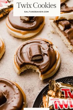 chocolate covered donuts sitting on top of a table