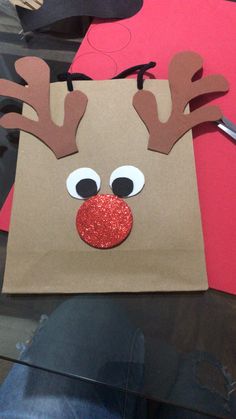 a paper bag with reindeer's nose on it