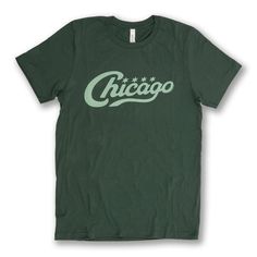 A mix of modern styling and vintage vibes this Chicago Vintage Script Tee is the next classic staple to any wardrobe.  Make of the shirt is 100% Combed Ringspun Cotton. Designed and hand screen printed by Transit Tees in Chicago's Wicker Park neighborhood. What is Transit Tees? Founded in 2001 by Tim Gillengerten, Transit Tees takes visuals from Chicago's metropolitan landscapes and transforms them into fashionable artwork, accessories, home goods and more. Transit Tees locally designs, fabricates and retails their signature brand online and at two storefronts in the Wicker Park and Andersonville neighborhoods. Items in stores are created in their design studio and produced on-site by local artists and craftsmen. Visit our online store at https://www.transittees.com/ Order Status You can c Vintage Tops With Text Print For Everyday, Retro T-shirt For Everyday Fall Wear, Retro Relaxed Fit Shirt For Everyday, Retro Green Tops With Text Print, Fitted Vintage T-shirt With Text Print, Vintage Green Shirt With Screen Print, Retro Green Screen Print Shirt, Retro Fitted Green T-shirt, Retro Everyday T-shirt For Fall