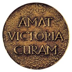 a bronze medal with the words amat victoria curam on it's side