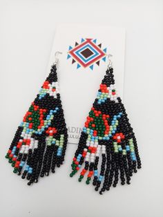 Amazing colors combined in a Modern Powwow Native American Style Seed Bead Earring set. Great new petite BOHO design with great colors and styling. Black color with cute flowers and shapes. Stainless steel ear wires and genuine high quality beads. A beautiful combination of colors and native design at a super price. All handmade. Shipped Free Design Seed, Native American Style, Native Design, Handmade Earrings Beaded, Design Seeds, Boho Design, Native American Fashion, Rainbow Design, Boho Designs