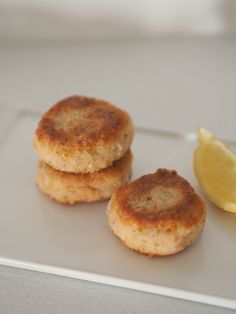 two biscuits and a lemon on a plate