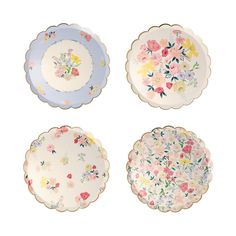 four plates with flowers painted on them