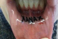 a person holding their mouth open with the word think written on it's tongue