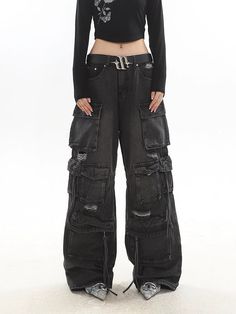 Experience the ultimate blend of streetwise flair and classic comfort with our Distressed Wide-Leg Denim Cargo Pants.Made with premium denim, these pants boast a relaxed wide-leg fit and a natural waist design, providing a comfortable experience without compromising on style. The distressed details and multiple pockets echo a laid-back vibe while adding practicality and edge to your look. These versatile pants serve as the perfect canvas for a variety of styling options – pair them with a sleek Y2k Wide Leg Jeans For Fall, Baggy High Rise Flare Jeans For Streetwear, Grunge Full-length Cargo Jeans For Streetwear, Casual Wide-leg Jeans With Belt Loops, Grunge Full-length Jeans For Streetwear, Fall Grunge Straight Leg Cargo Jeans, Black Denim Wide Leg Pants With Pockets, Y2k Style Wide Leg Flare Jeans With Pockets, Y2k Wide Leg Flare Jeans With Pockets