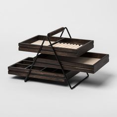 two wooden trays stacked on top of each other, one with an open drawer