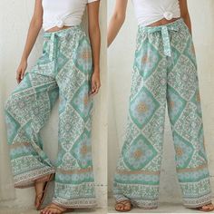 Floral Printing Wide Leg, Floor Length, Drawstring Waist. You Will Look Attractive To Wear It Just Pair With The Simplest Tee. Fabric 100% Polyester Pre-Order Casual Green Boho Print Bottoms, Bohemian White Bottoms With Elastic Waistband, White Bohemian Pants For Vacation, Spring Beach Green Harem Pants, White Bohemian Bottoms With Elastic Waistband, White Bohemian Harem Pants For Vacation, Spring Beach Harem Pants With Boho Print, Bohemian White Bottoms For Loungewear, Bohemian White Pants With Elastic Waistband