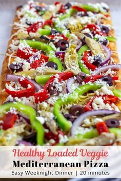 healthy loaded veggie mediterranean pizza is ready to be eaten