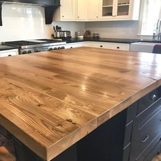 a large wooden counter top in a kitchen