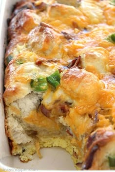 a casserole dish with green peppers and cheese