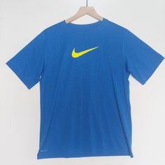 Nike Dri-Fit T-Shirt, Size Xl, Nwot, Tags Removed & Never Worn. Made From Rich Cotton Fabric Crew Neck And Short Sleeves Interior Taping To Neck For Durability Regular Fit Nike Swoosh Branding Chest Print Ptp 21" Length 27 Bin 22 Yellow Sports T-shirt With Logo Print, Nike Blue Crew Neck T-shirt, Yellow Graphic Tee For Sports, Nike Blue Short Sleeve T-shirt, Yellow Sports T-shirt With Logo, Blue Nike T-shirt With Logo Print, Nike Blue T-shirt With Logo Print, Nike Yellow Graphic Print Tops, Nike Yellow T-shirt With Graphic Print