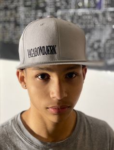 "**Just 1 left** Gray with black stitching  \"VagabondJerk\"  Snapback hat is an attention grabbing perfect way to show off your unique style & individualism. Embrace your stylish side with this Vagabond Jerk New York exclusive.  Vagabond Jerk New York is a combined effort of our two in-house artists, Noelle Winters and C.S. Hughes. Who started the thought process more than ten years ago, through roads, hills, mountains and time are now  bringing their art & the Vagabond Jerk New York fashion to people everywhere." Fitted Hats For Streetwear, Gray Urban Snapback Hat For Streetwear, Streetwear Fitted Baseball Cap, Fitted Baseball Cap For Streetwear, Fitted Flat Brim Baseball Cap For Streetwear, Fitted Flat Brim Hat For Streetwear, Fitted Snapback Cap For Streetwear, Fitted Snapback Baseball Cap For Streetwear, Fitted Casual Baseball Cap For Streetwear