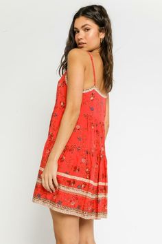 Final Sale - Get it before its gone! The Having A Moment Red Floral Swing Dress is going to be your go-to dress this summer! Stand out in this red floral print dress that forms a straight neckline with adjustable spaghetti straps. The relaxed swing silhouette continues down to a mini hem. Features a contrasting border trim on neckline and hemline and pearlized button-down bodice. Style with brown sandals for the perfect boardwalk outfit this summer. DETAILS & CARE Rayon. Machine Wash Cold. Impor Summer Rayon Sundress With Adjustable Straps, Red Sundress With Adjustable Straps, Red Sundress With Adjustable Straps For Spring, Rayon Sundress With Spaghetti Straps, Red Vacation Dress With Adjustable Straps, Vacation Dress With Adjustable Straps In Red, Summer Rayon Dress With Square Neck, Summer Square Neck Rayon Dresses, Casual Red Mini Dress With Adjustable Straps