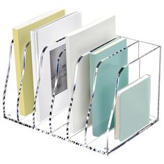 three binders and two folders in a metal holder