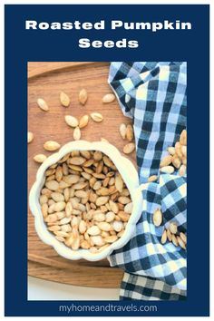 roasted pumpkin seeds in a white bowl on a cutting board with blue checkered cloth