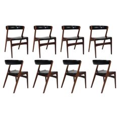 six chairs with black leather upholstered seats